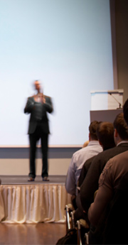 Corporate trainer using H-ITT wireless audience response system for interactive polling and employee engagement